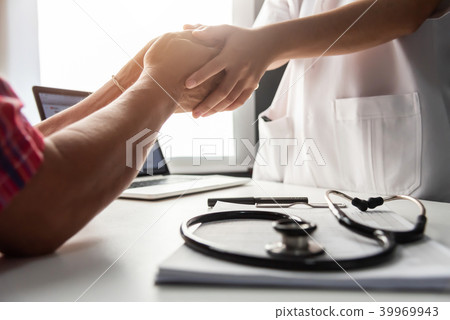 Senior male patient handshaking with Doctor female Senior male patient handshaking with Doctor female 39969943