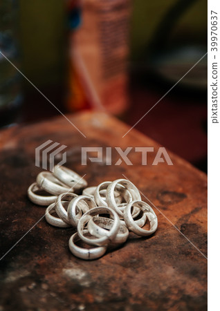 Making silver ring Close up of Jeweler crafting Making silver ring Close up of Jeweler crafting 39970637
