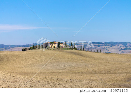 Tuscany landscape with ploughed field and blue sky 39971125