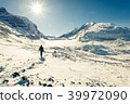 Young man hiking at Athabasca Glacier 39972090