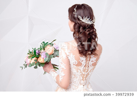 Female Elegant wedding hairstyle for the wedding, unrecognizable rear view. 39972939