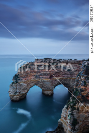 Mountains and arches in the shape of a heart on the beach Marinha. Mountains and arches in the shape of a heart on the beach Marinha. 39973984
