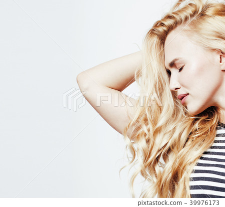 young pretty blond teenage girl emotional posing, happy smiling  39976173