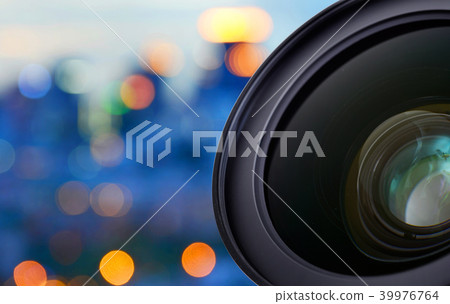 Closeup of camera lens on blur bokeh background Closeup of camera lens on blur bokeh background 39976764