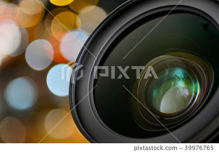 Closeup of camera lens on blur bokeh background 39976765