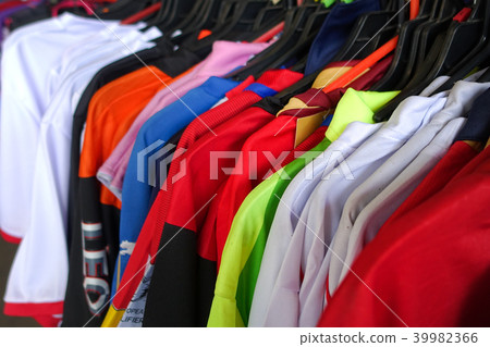 Fashion clothes on clothing rack - bright colorful Fashion clothes on clothing rack - bright colorful 39982366