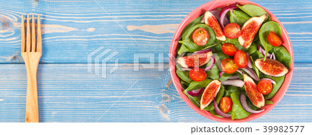 Fruit and vegetable salad with fork 39982577