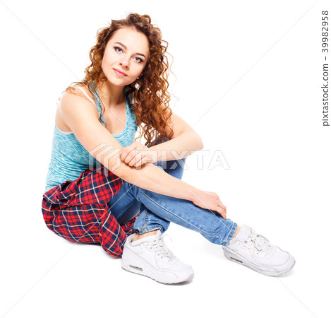 Young fit girl sitting on floor isolated on white Young fit girl sitting on floor isolated on white 39982958