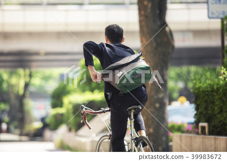 Youth riding a road bike 39983672