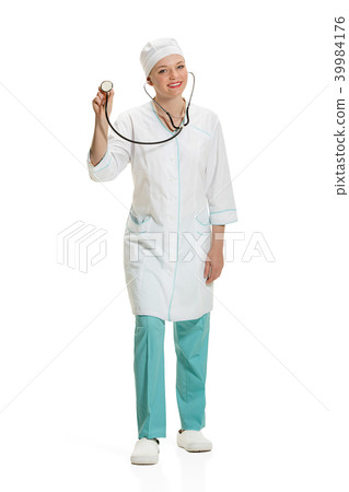 Beautiful young woman in white coat posing at studio. Full length studio shot isolated on white. Beautiful young woman in white coat posing at studio. Full length studio shot isolated on white. 39984176