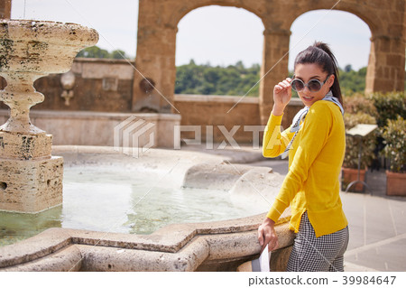The tourist visits a small Italian town The tourist visits a small Italian town 39984647