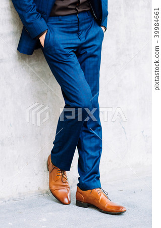 Lower part of man in formal suit posing. Lower part of man in formal suit posing. 39984661