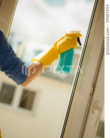 Hand cleaning window at home using detergent rag Hand cleaning window at home using detergent rag 39985954