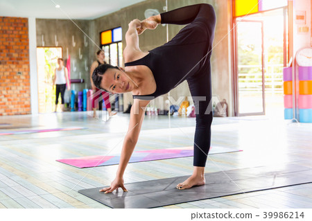 Yoga pose in gym. Yoga pose in gym. 39986214