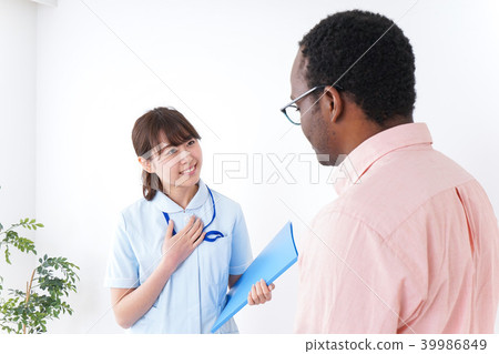 Foreign males receiving medical examination at hospital 39986849