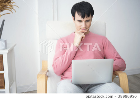 man working on laptop computer with thinking man working on laptop computer with thinking 39986950