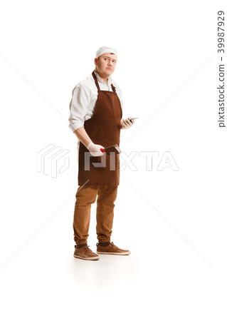 Serious butcher posing with a cleaver isolated on white background 39987929