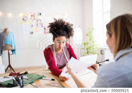 Young creative women in a studio, startup business. Young creative women in a studio, startup business. 39989925