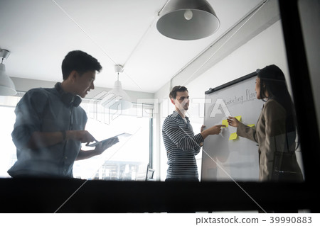 Business people discussing about business plan. 39990883