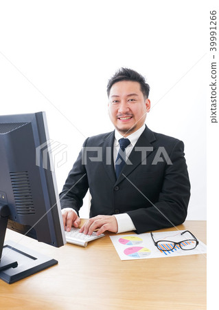 Businessman who enjoys work Businessman who enjoys work 39991266