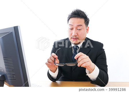 Businessman who is tired from long working hours, working style reform Businessman who is tired from long working hours, working style reform 39991286