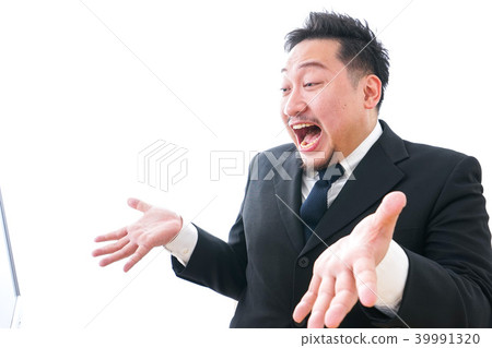 Businessman scolding in front of a personal computer 39991320