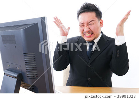 Businessman scolding in front of a personal computer 39991328