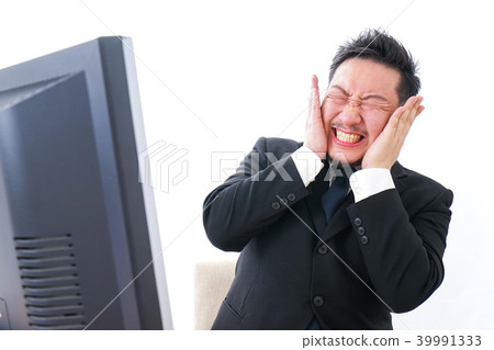 Businessman scolding in front of a personal computer 39991333