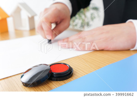 Man making a contract for real estate 39991662