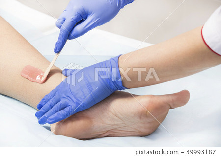 The process of classical wax depilation of female The process of classical wax depilation of female 39993187