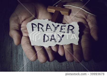 man with a crucifix and the text prayer day man with a crucifix and the text prayer day 39993678