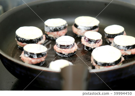 Grilled eggplant with scissors 39994450