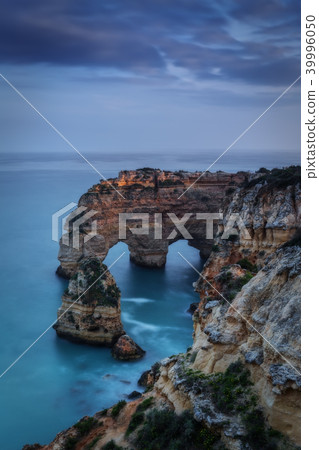 Mountains and arches in the shape of a heart on the beach Marinha. Mountains and arches in the shape of a heart on the beach Marinha. 39996050
