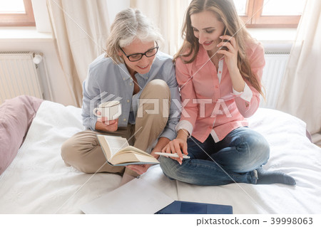 Mother and daughter leading the family business from home  39998063