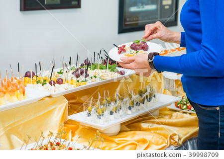Catering table with dishes and snacks on event Catering table with dishes and snacks on event 39998709