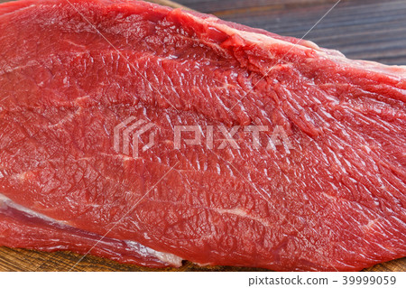 Texture of fresh raw beef meat on wooden table 39999059
