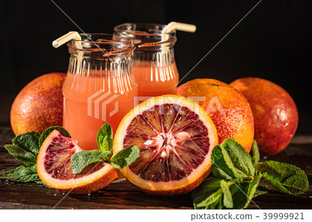 Jars of fresh blood orange juice, selective focus 39999921