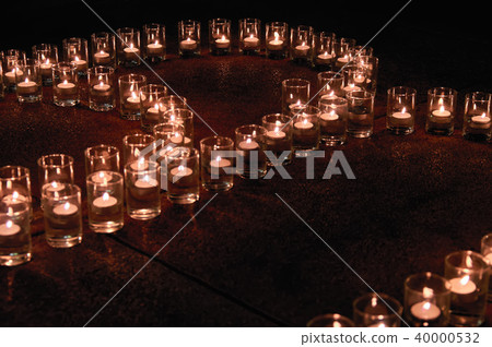 Burning candles in glass flasks. Burning candles in glass flasks. 40000532