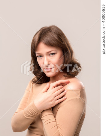 young beautiful woman in beige blouse young beautiful woman in beige blouse 40000619
