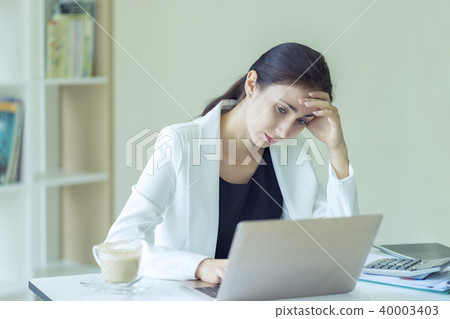 Businesswoman frustrated and stressed on his work 40003403