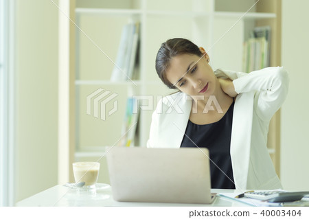 Businesswoman feeling pain in neck, tired suffer 40003404