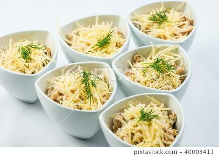 salad cheese, mushrooms, chicken, meat, dill, sauce in white plate on white background 40003411