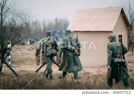 Soldiers of the Wehrmacht in gray greatcoats 40007722