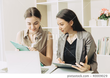 Two Businesswoman team worker co-working Two Businesswoman team worker co-working 40009029