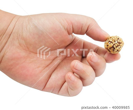 Hand Holding Chocolate Candy Ball with Sesame Hand Holding Chocolate Candy Ball with Sesame 40009985