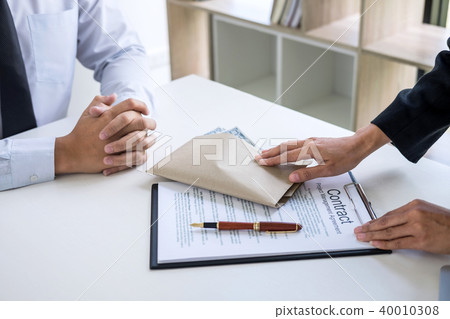 Bribery and corruption concept, bribe in the form of dollar bill 40010308