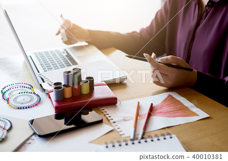 Close up of professional Fashion designer working and drawing sk Close up of professional Fashion designer working and drawing sk 40010381