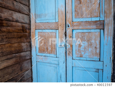 vintage wooden blue door building style 40011597
