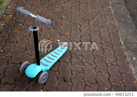 children scooter in a park children scooter in a park 40013251