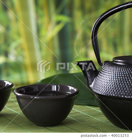 Green tea with black china kettle. Chinese tea. Green tea with black china kettle. Chinese tea. 40013253